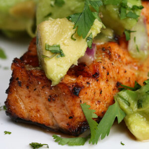 Grilled salmon with avocado salsa.